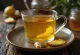 Hot ginger spiced tea in a mug with lemon and cinnamon